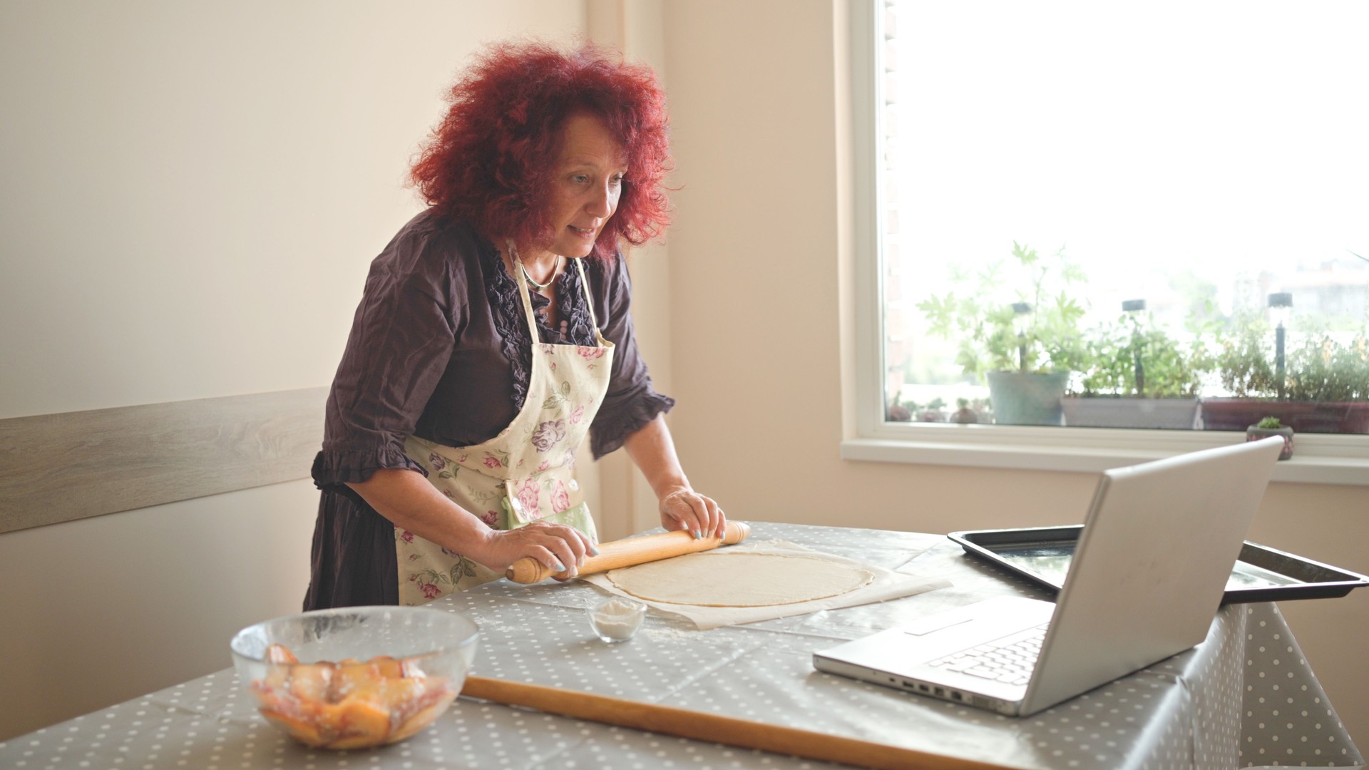 Woman hosting virtual cooking class.